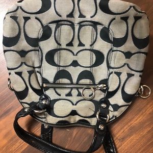Gray and black coach purse